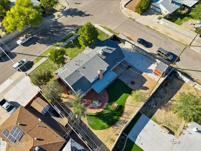 an aerial view of house with yard