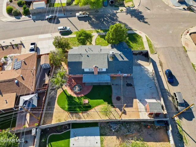 an aerial view of house with a yard