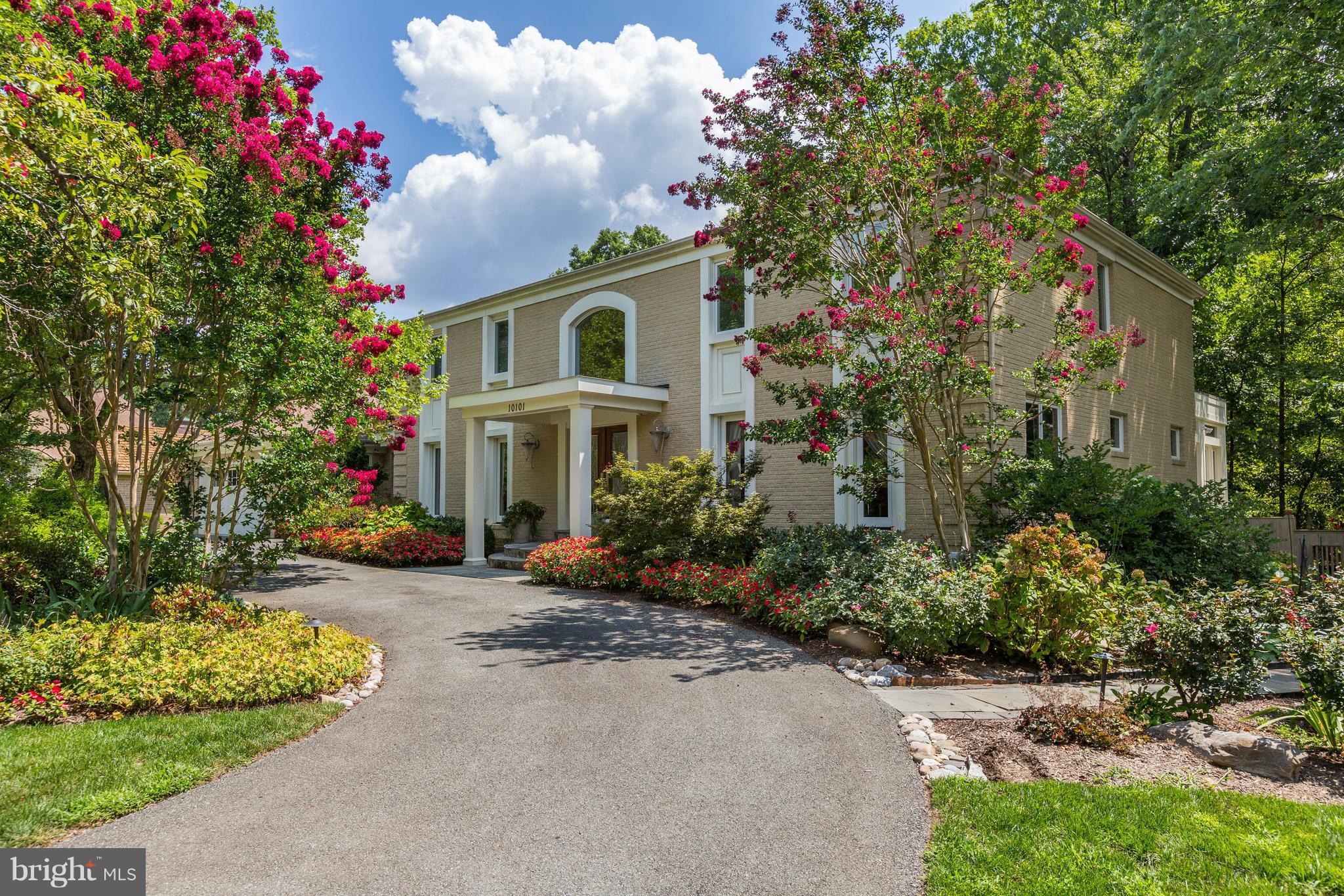 10101 Ormond Road Potomac, MD 20854 - Photo 1 of 30 a front view of a house with a yard and potted plants