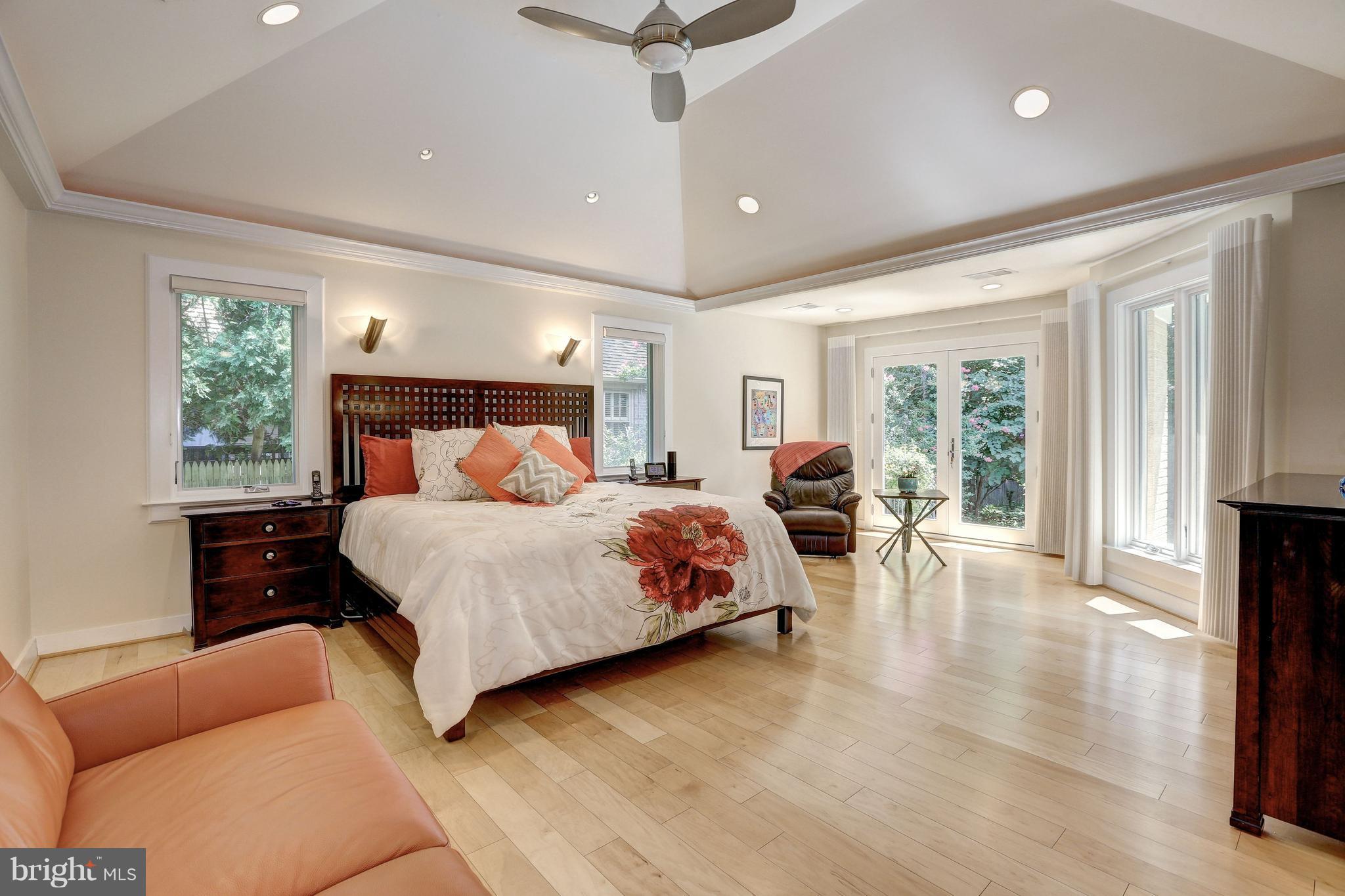 10101 Ormond Road Potomac, MD 20854 - Photo 16 of 30 a bedroom with a large bed and a couch