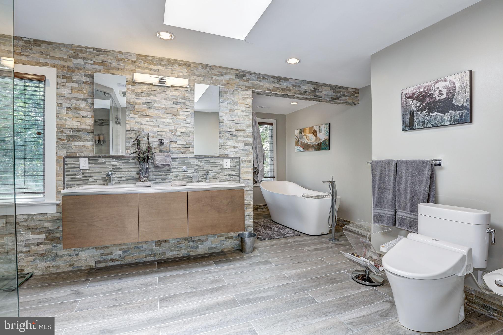 10101 Ormond Road Potomac, MD 20854 - Photo 21 of 30 a bathroom with a toilet sink and mirror