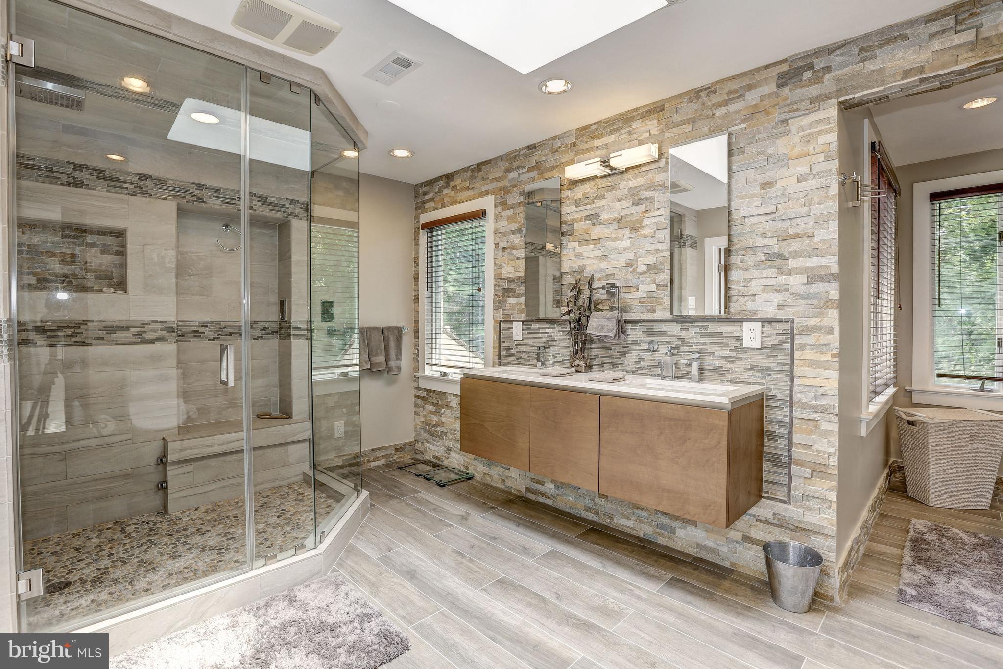 10101 Ormond Road Potomac, MD 20854 - Photo 22 of 30 a bathroom with a sink and a mirror
