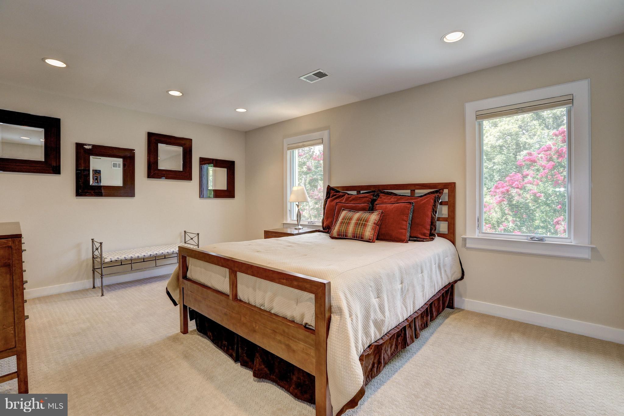 10101 Ormond Road Potomac, MD 20854 - Photo 25 of 30 a bed sitting in a bedroom next to a window