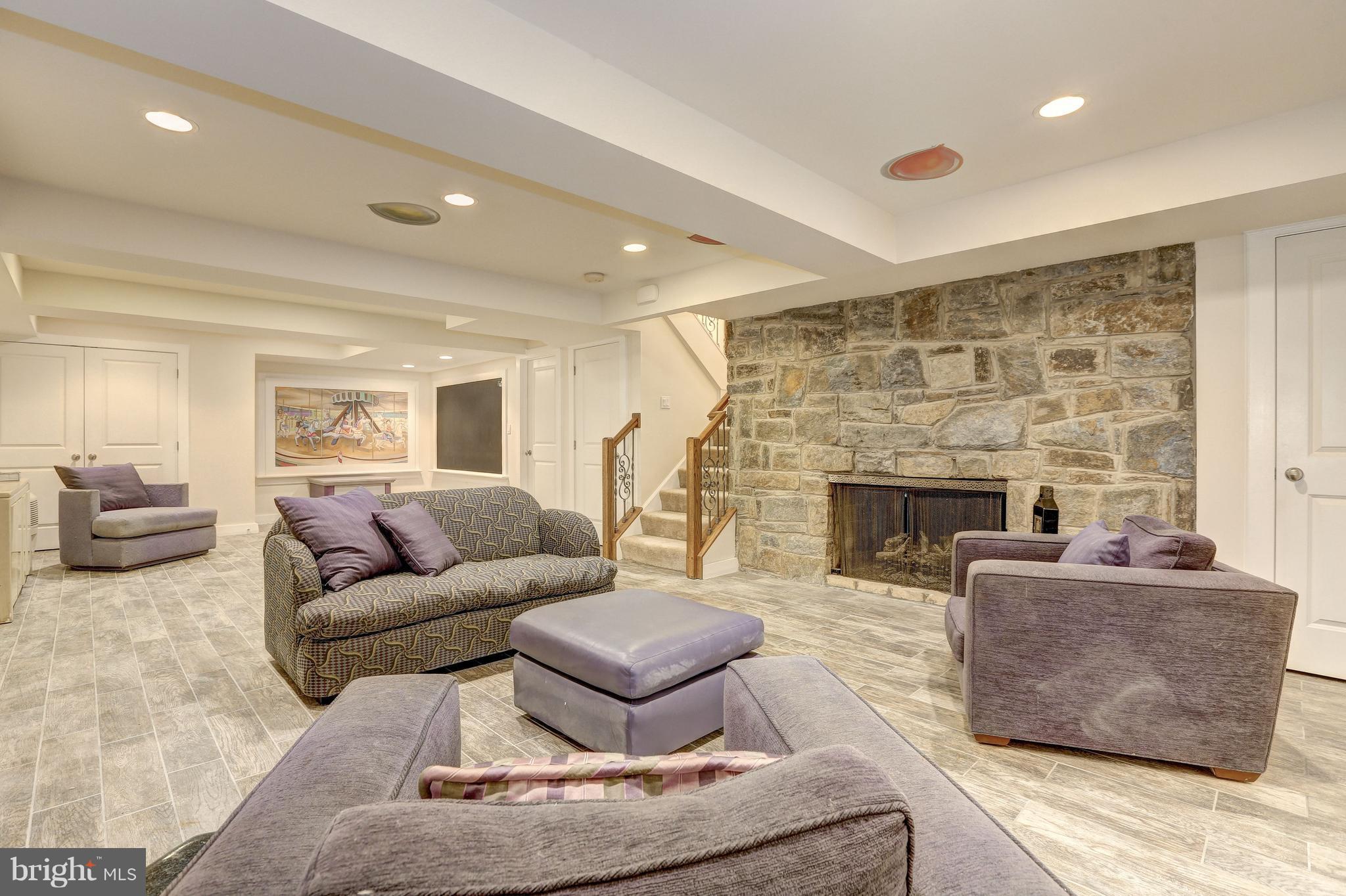 10101 Ormond Road Potomac, MD 20854 - Photo 28 of 30 a living room with furniture and a fireplace