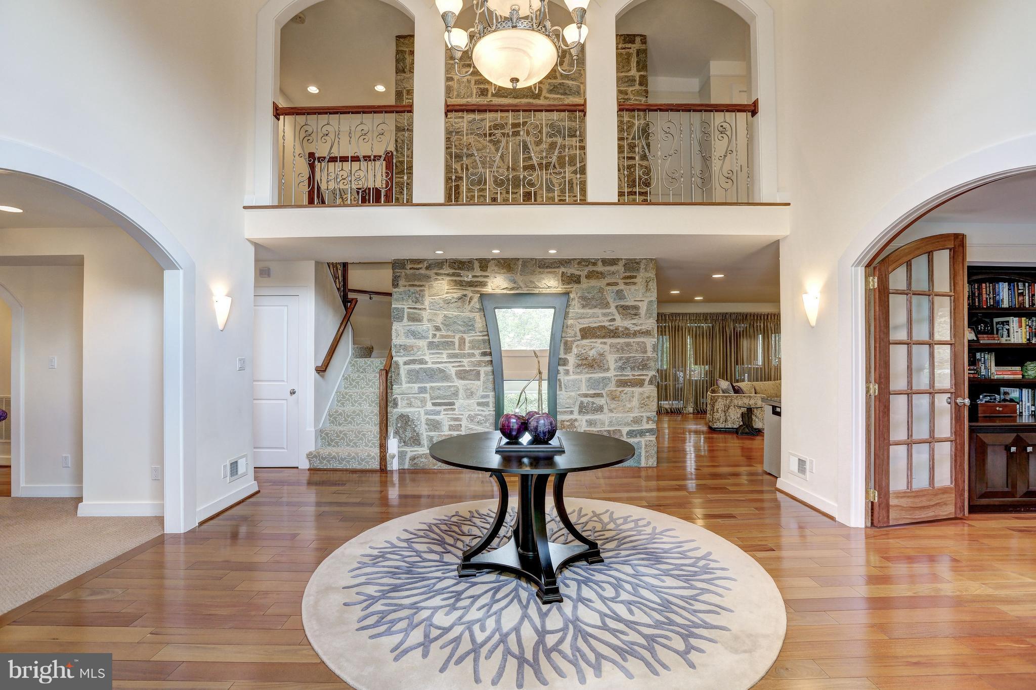 10101 Ormond Road Potomac, MD 20854 - Photo 4 of 30 a living room with furniture chandelier and a window