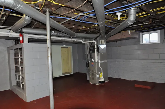 a view of an empty room with a fireplace