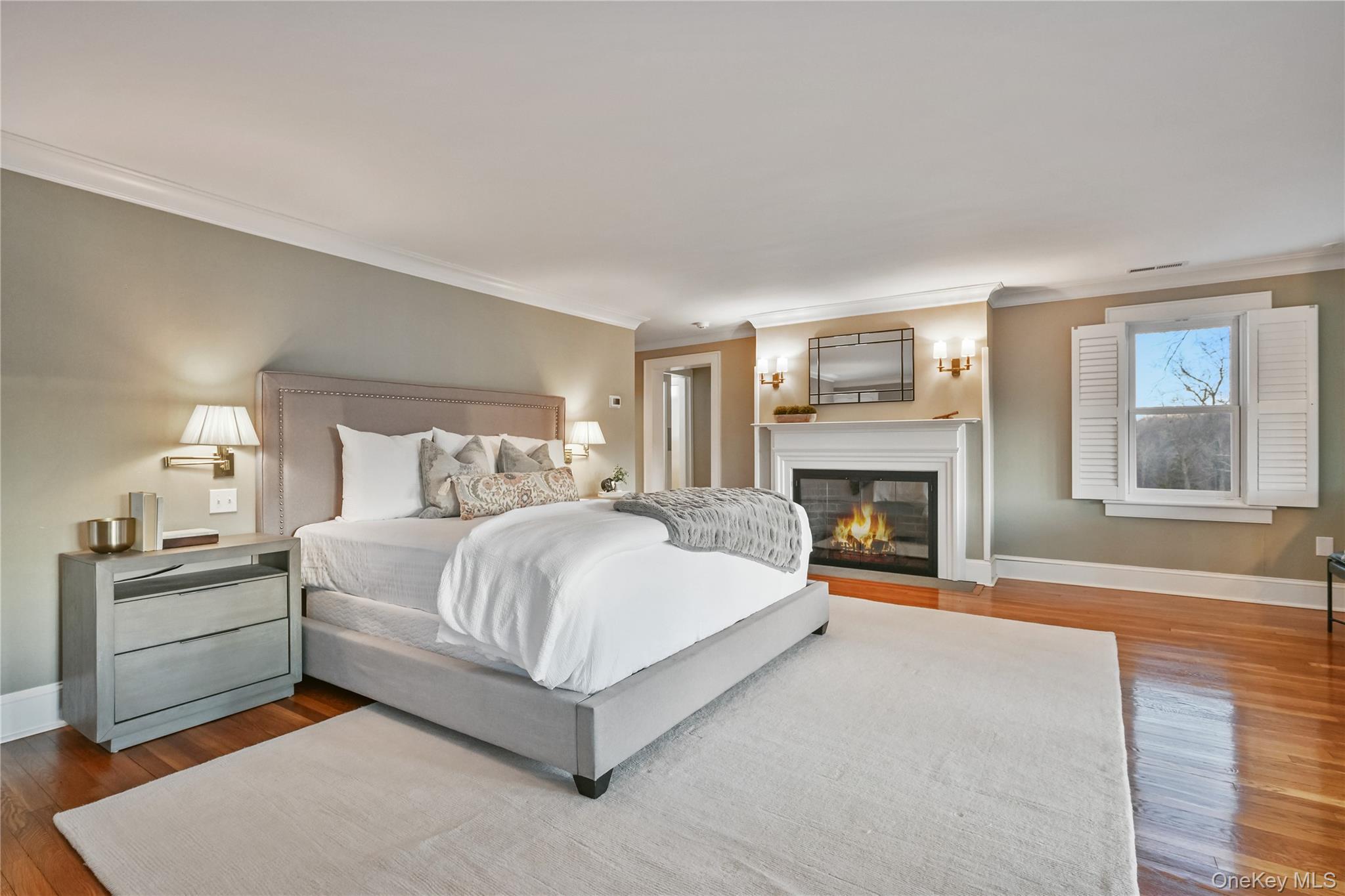 151-155 Long Ridge Road Danbury, CT 06810 - Photo 19 of 48 a bedroom with a large bed and a fireplace