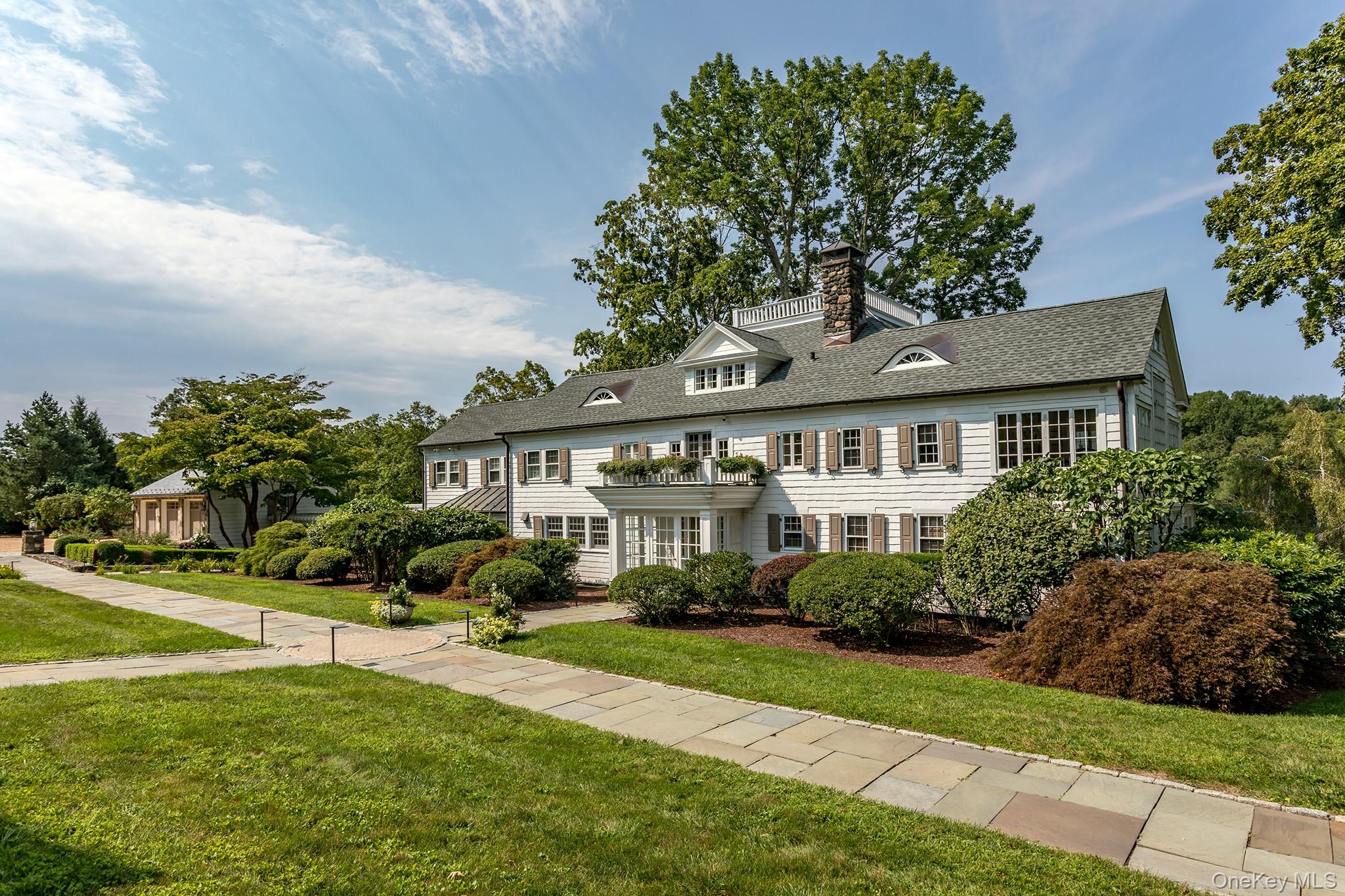 151-155 Long Ridge Road Danbury, CT 06810 - Photo 33 of 48 a front view of a house with a garden