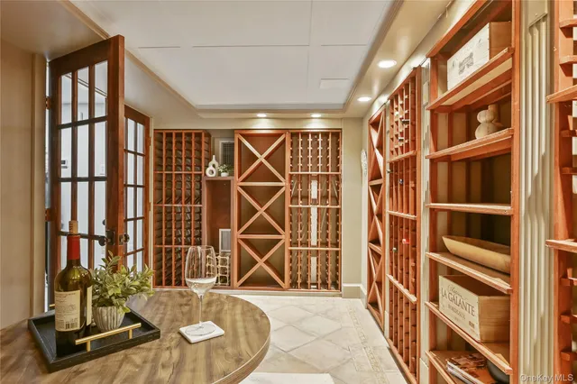 a kitchen with stainless steel appliances a large counter top a stove and a refrigerator