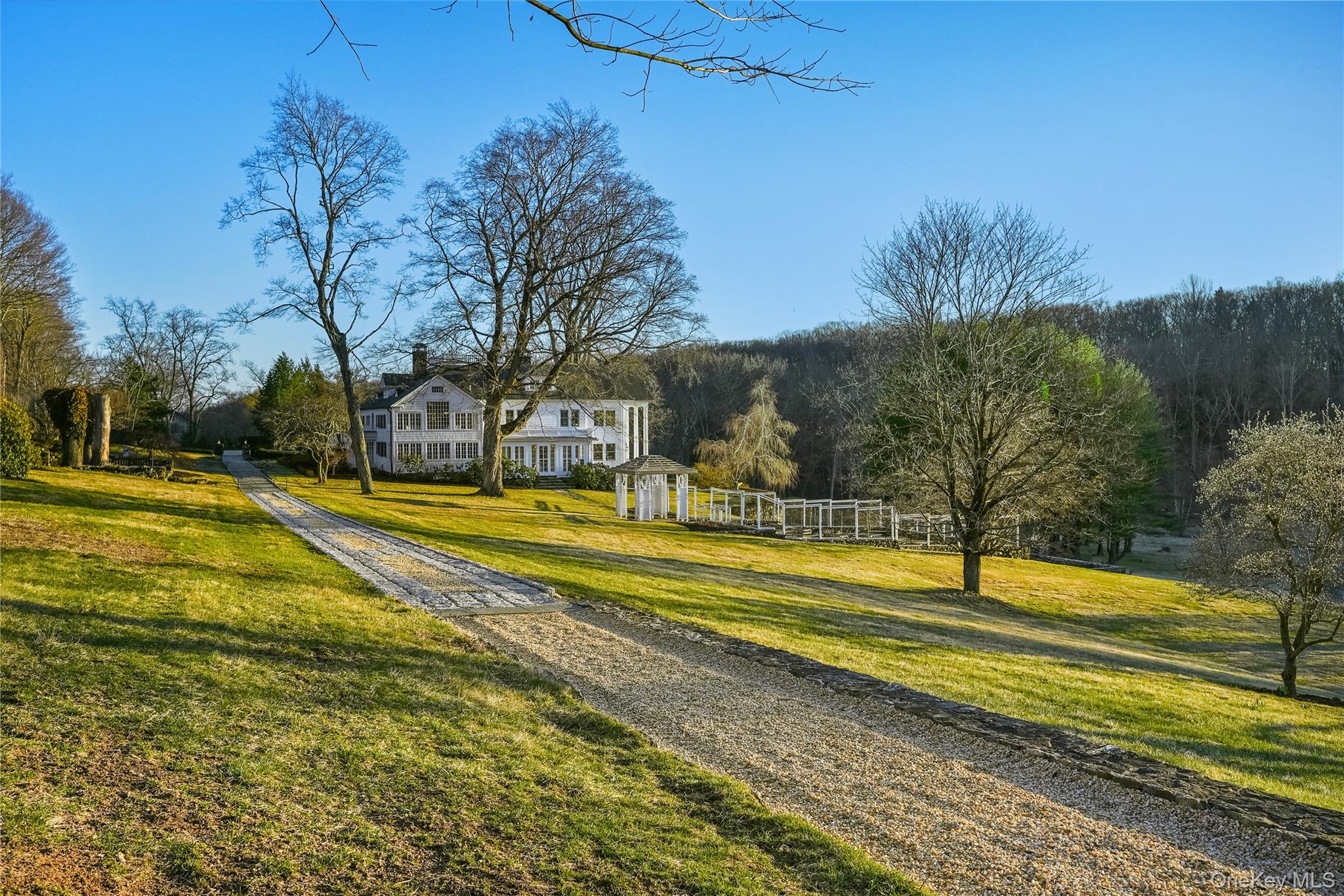 151-155 Long Ridge Road Danbury, CT 06810 - Photo 42 of 48 a view of swimming pool with outdoor seating and trees in the background