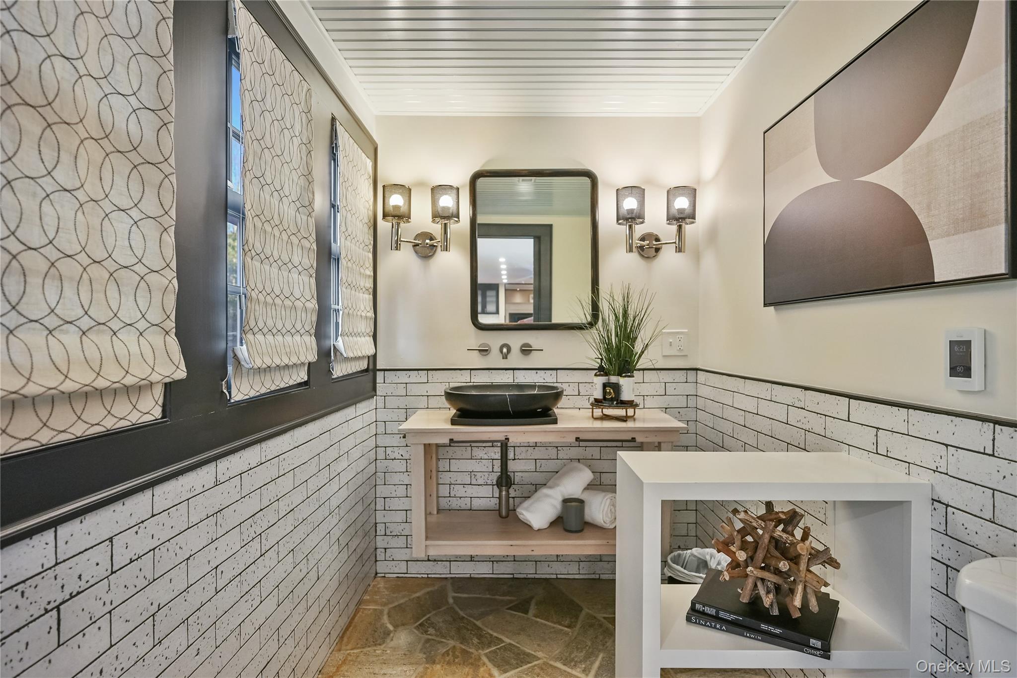 151-155 Long Ridge Road Danbury, CT 06810 - Photo 45 of 48 a bathroom with a sink a mirror and bathtub