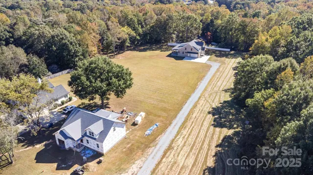 a view of a swimming pool with a yard