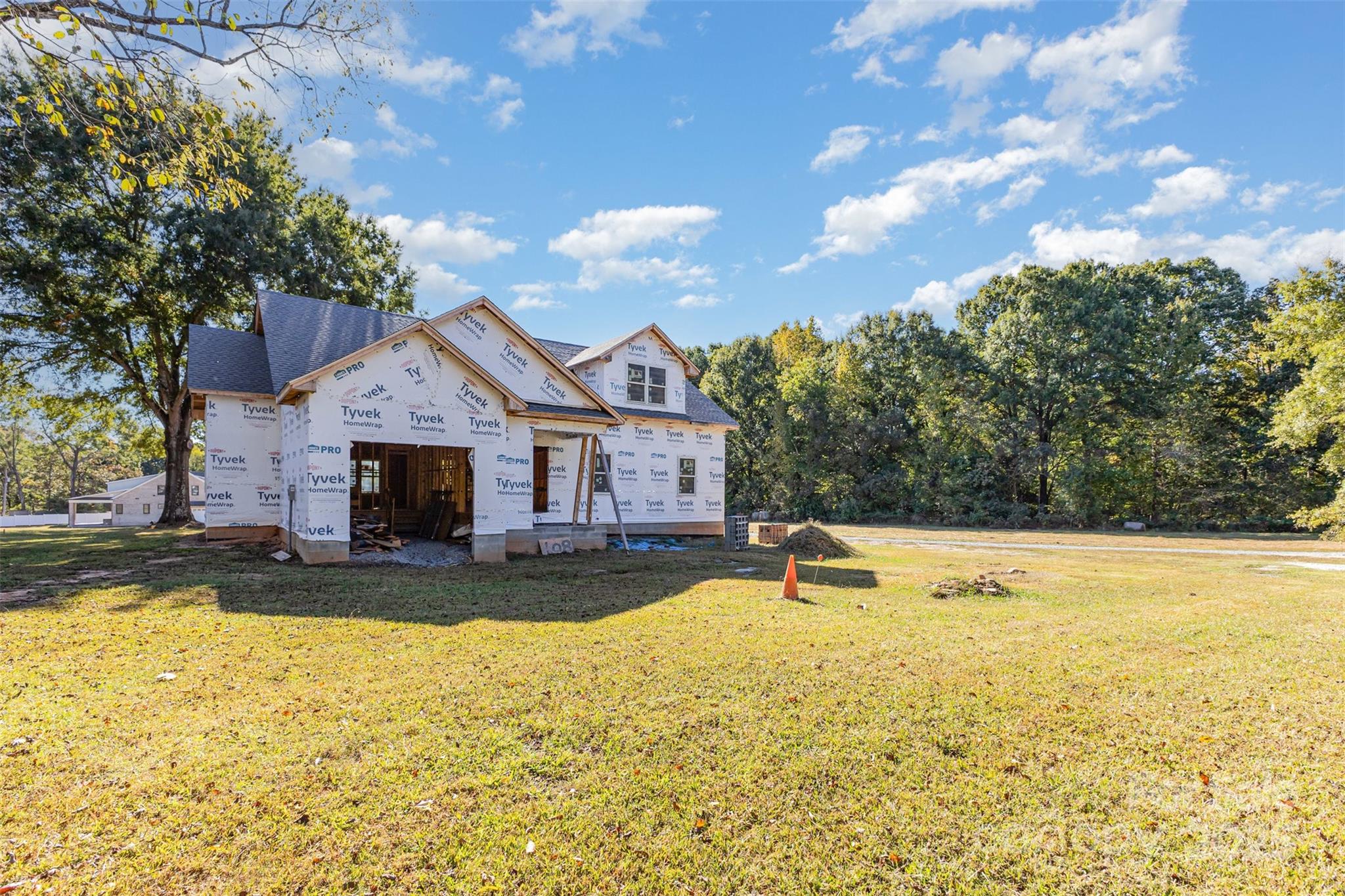 108 Jim Parker Road Wesley Chapel, NC 28110 - Photo 4 of 11 a view of a house with swimming pool and sitting area