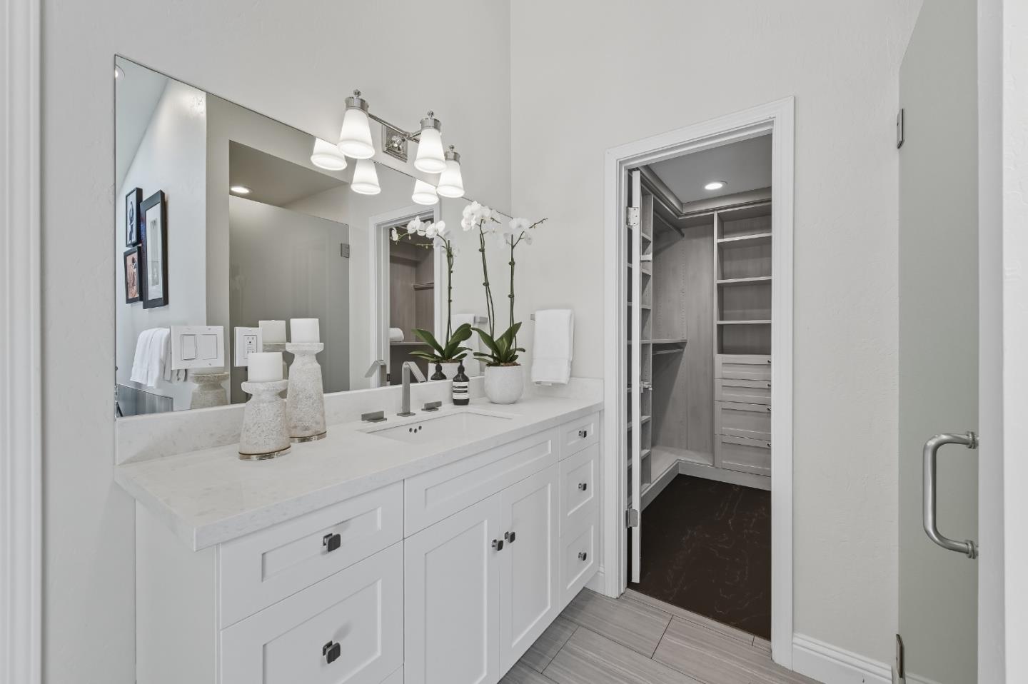 27464 Altamont Road Los Altos Hills, CA 94022 - Photo 15 of 29 a bathroom with a double vanity sink and a mirror