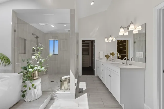 a bathroom with a sink a light fixture and a mirror