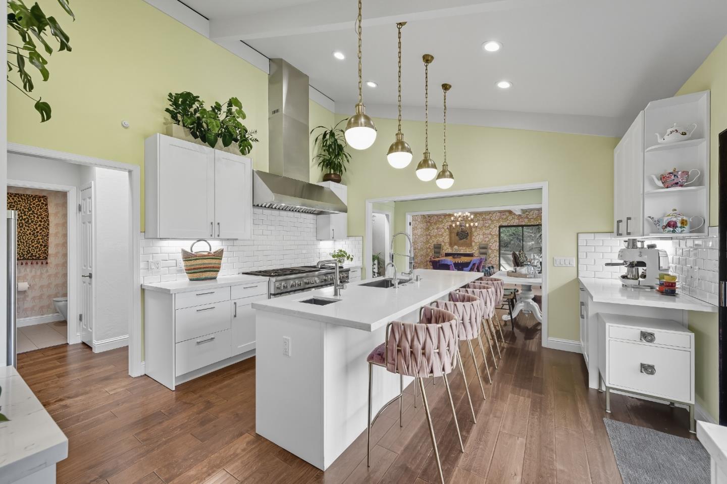 27464 Altamont Road Los Altos Hills, CA 94022 - Photo 6 of 29 a kitchen with stainless steel appliances granite countertop a stove a sink a refrigerator and a dining table with wooden floor