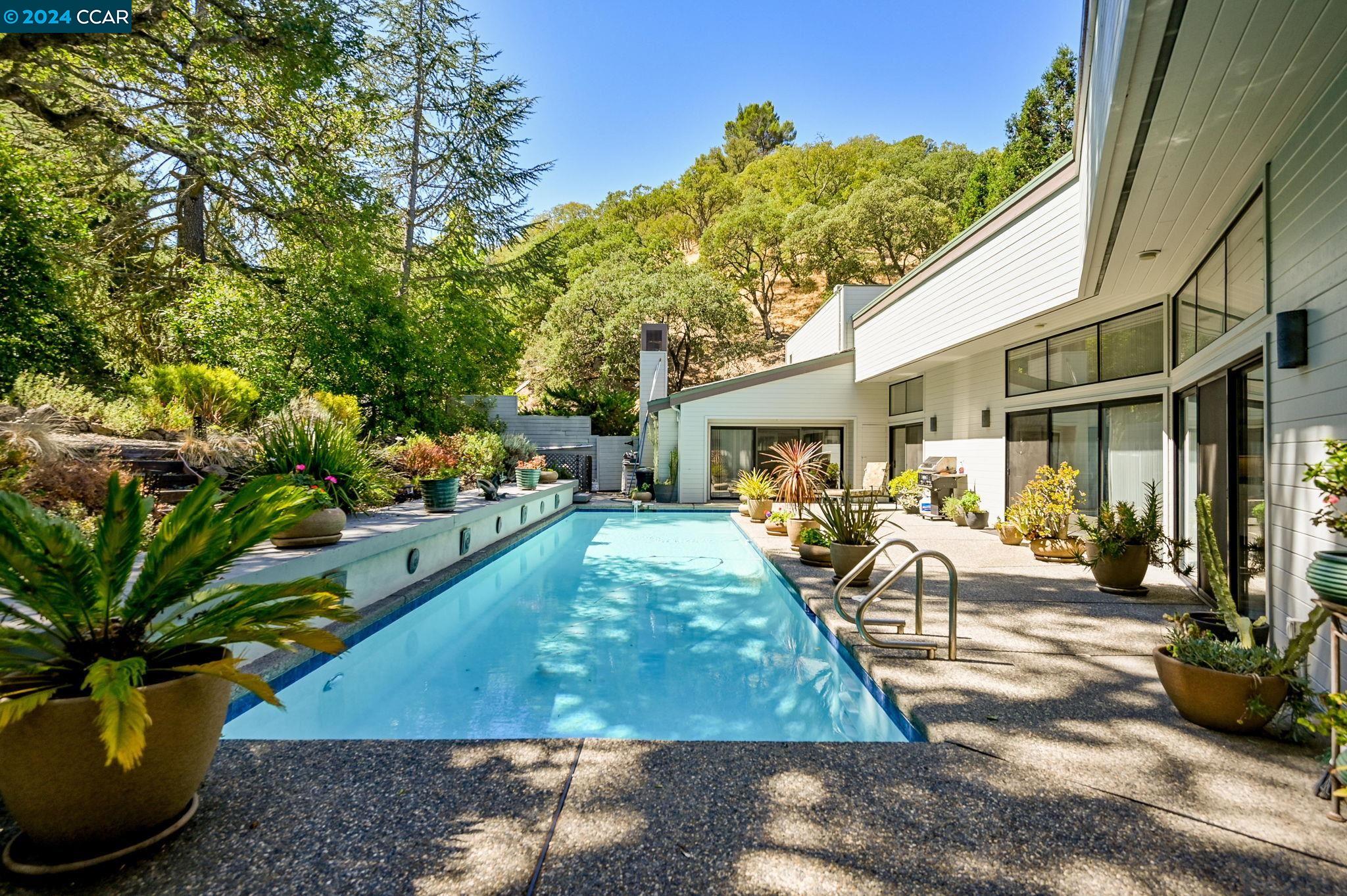 265 Castle Hill Ranch Road Walnut Creek, CA 94595 - Photo 1 of 1 a view of a house with backyard porch and sitting area