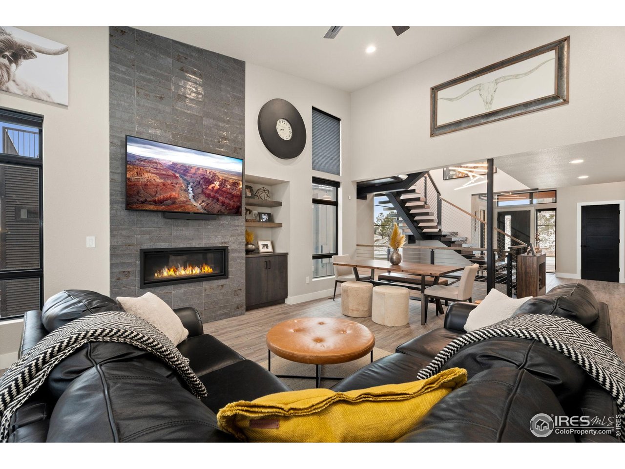 2089 Picture Point Drive Windsor, CO 80550 - Photo 12 of 45 a living room with furniture and a fireplace