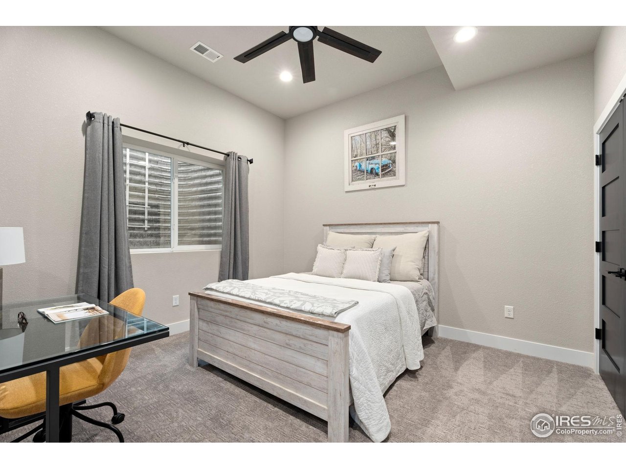 2089 Picture Point Drive Windsor, CO 80550 - Photo 20 of 45 a bedroom with a bed and a window