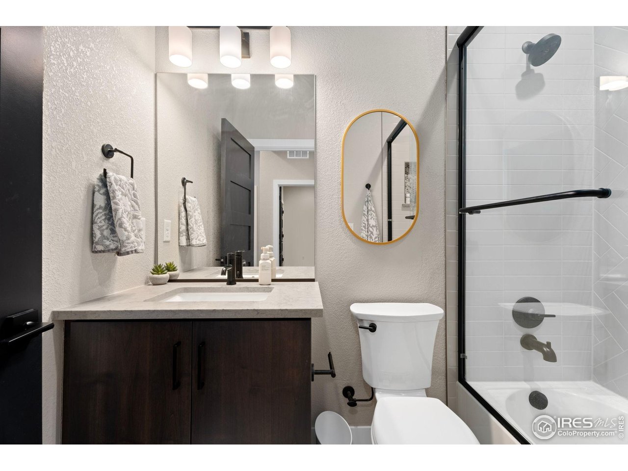 2089 Picture Point Drive Windsor, CO 80550 - Photo 21 of 45 a bathroom with a sink a toilet and a mirror