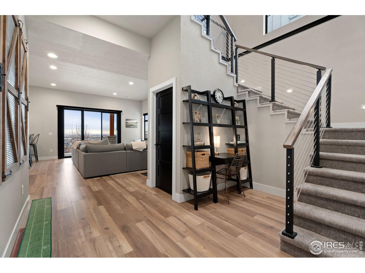 2089 Picture Point Drive Windsor, CO 80550 - Photo 22 of 45 a living room with furniture and a wooden floor