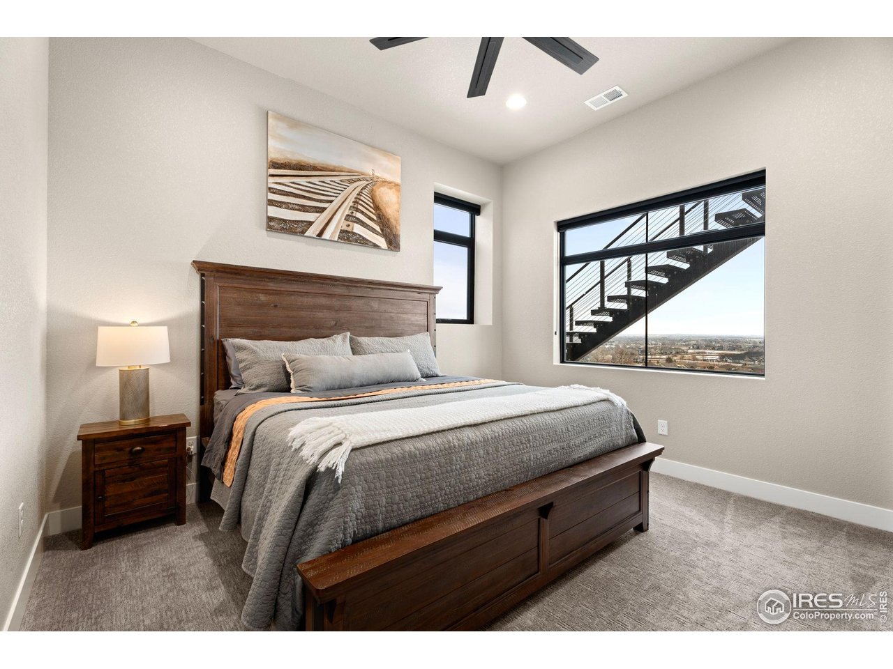 2089 Picture Point Drive Windsor, CO 80550 - Photo 27 of 45 a bedroom with a bed and a view of kitchen