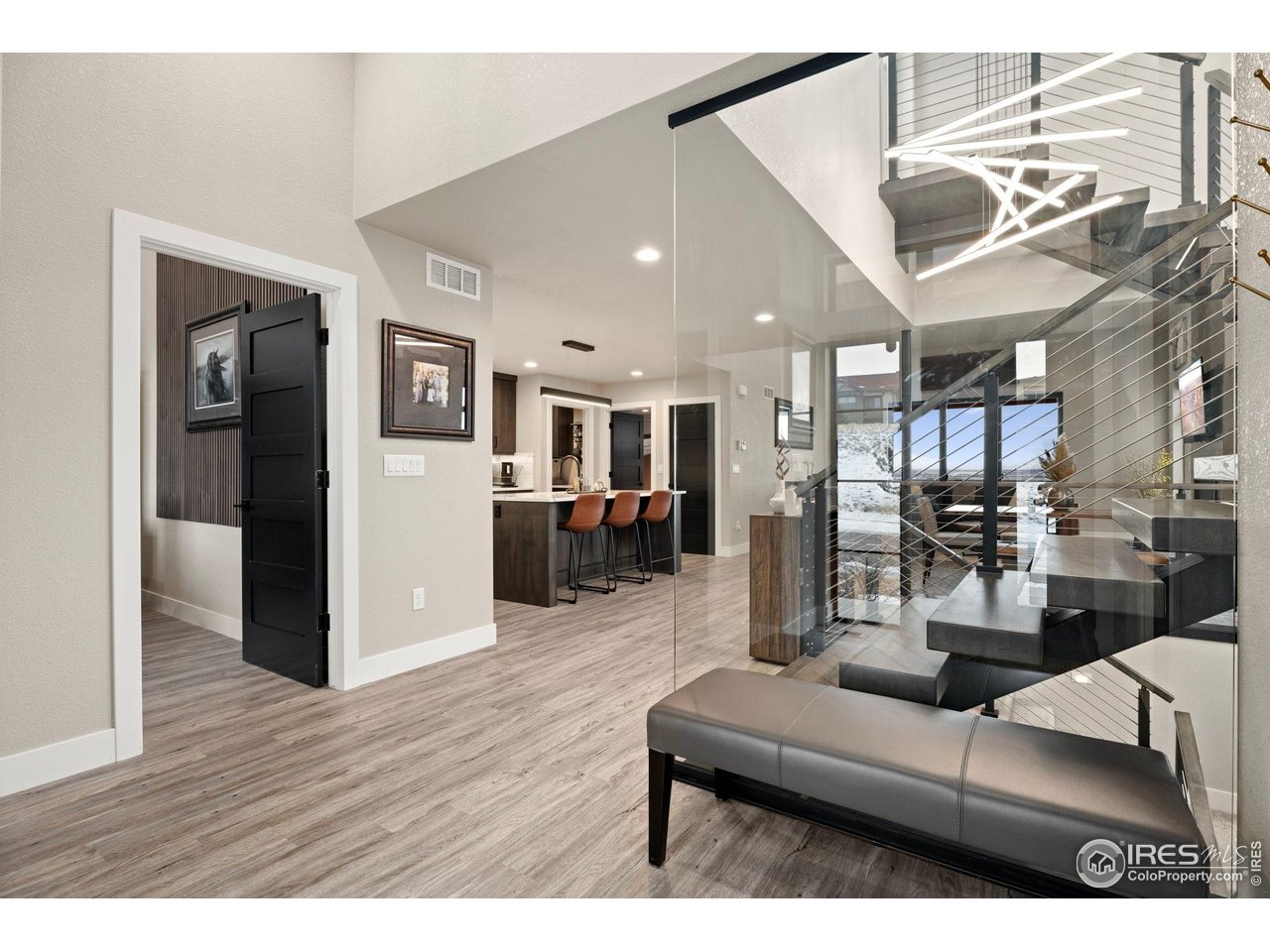 2089 Picture Point Drive Windsor, CO 80550 - Photo 3 of 45 a living room with furniture and kitchen view