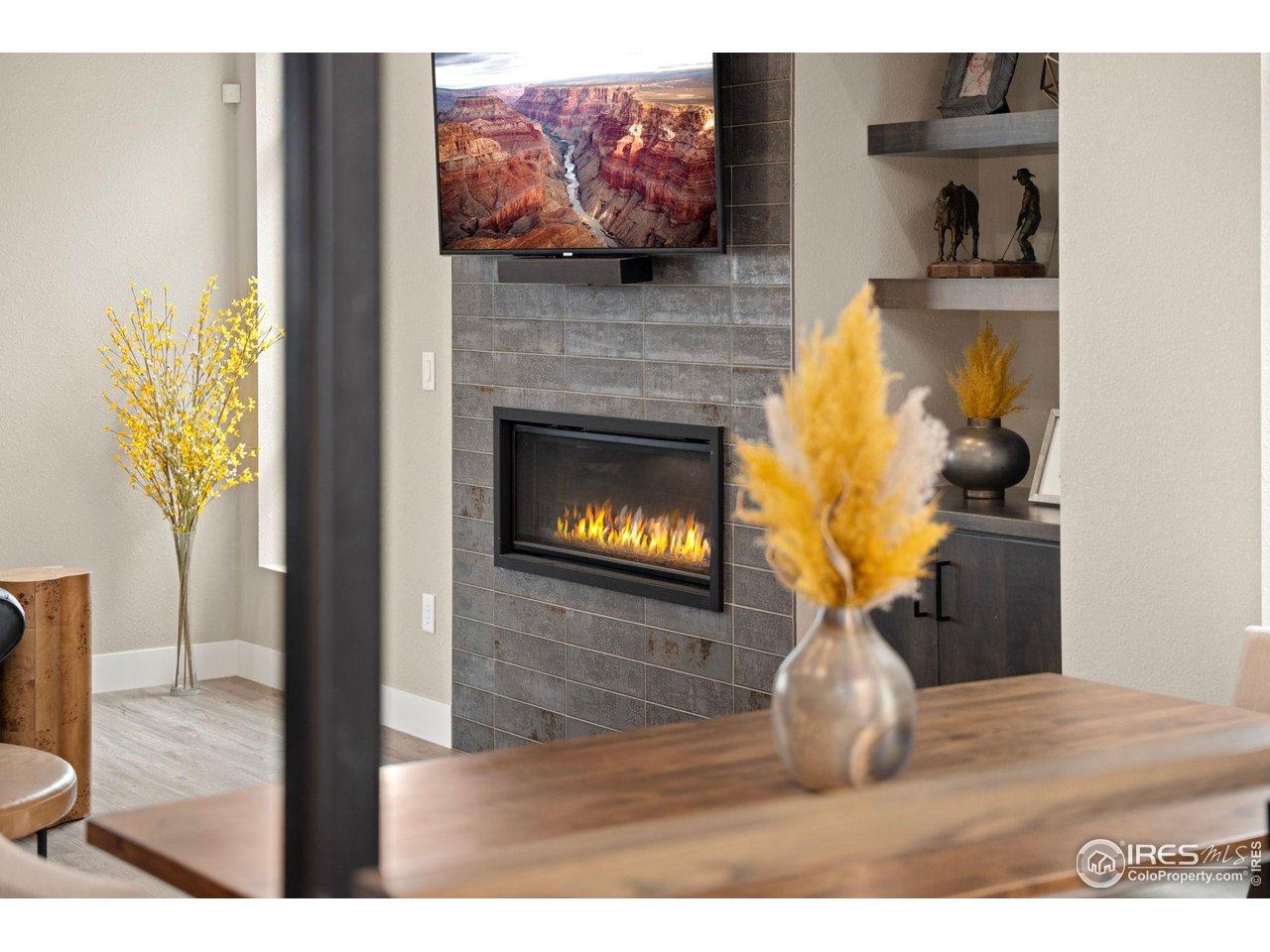 2089 Picture Point Drive Windsor, CO 80550 - Photo 31 of 45 a living room with furniture and a fireplace