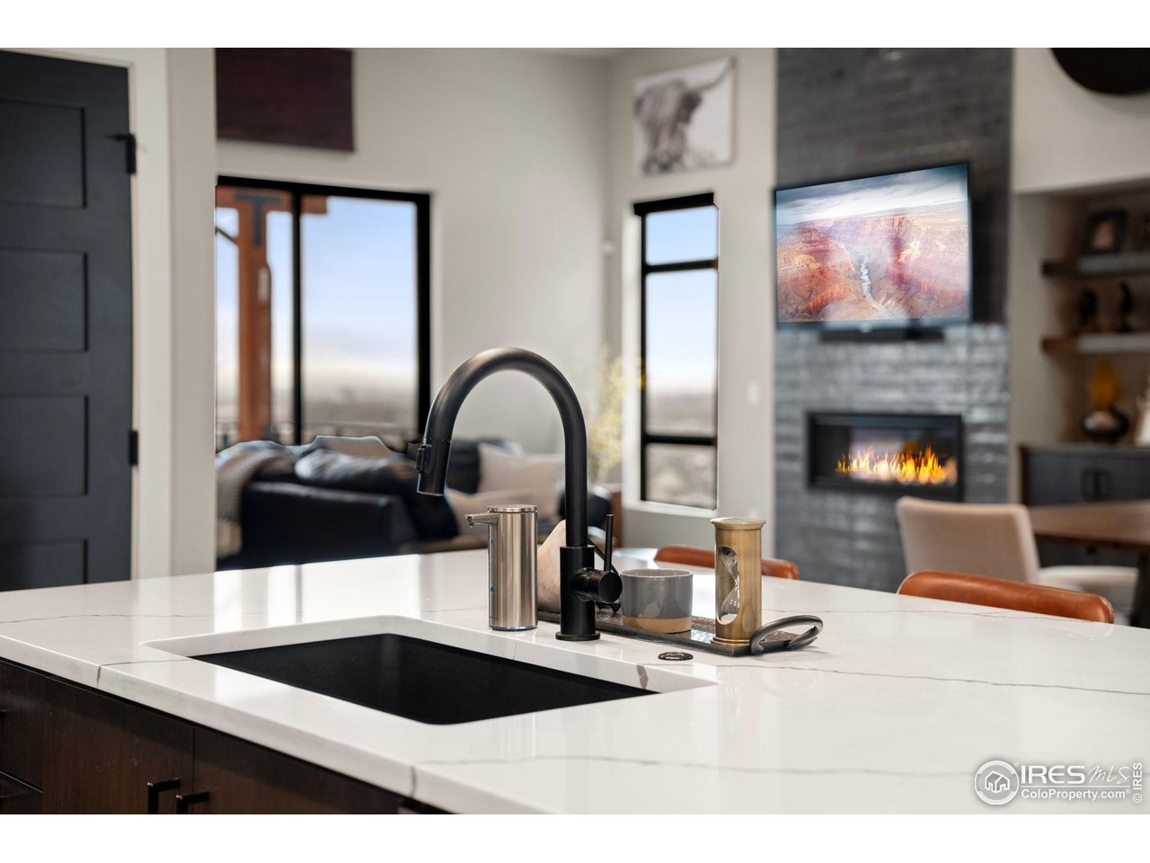2089 Picture Point Drive Windsor, CO 80550 - Photo 33 of 45 a kitchen with a refrigerator a stove and a sink with wooden floor