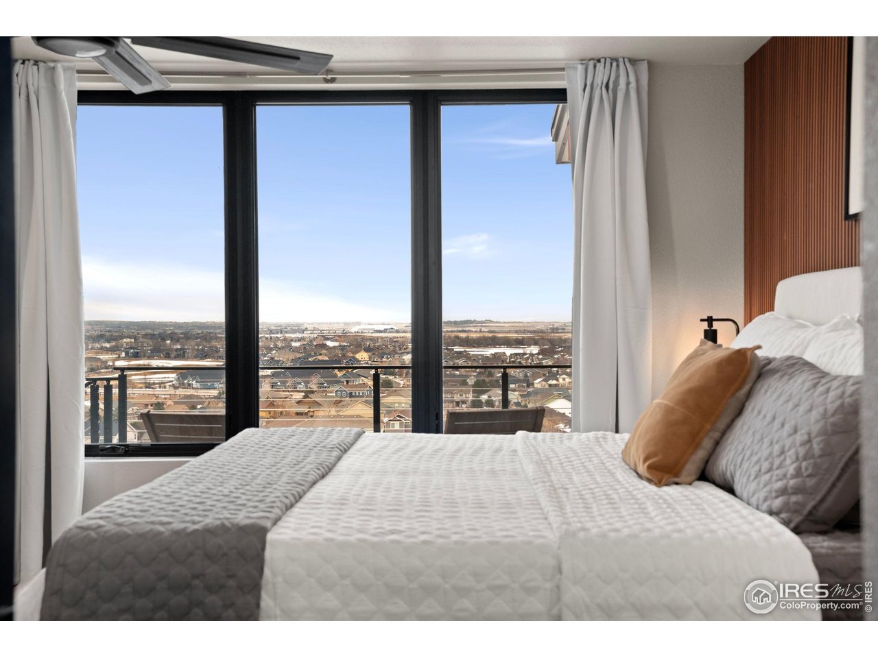 2089 Picture Point Drive Windsor, CO 80550 - Photo 34 of 45 a bedroom with a bed and a large window