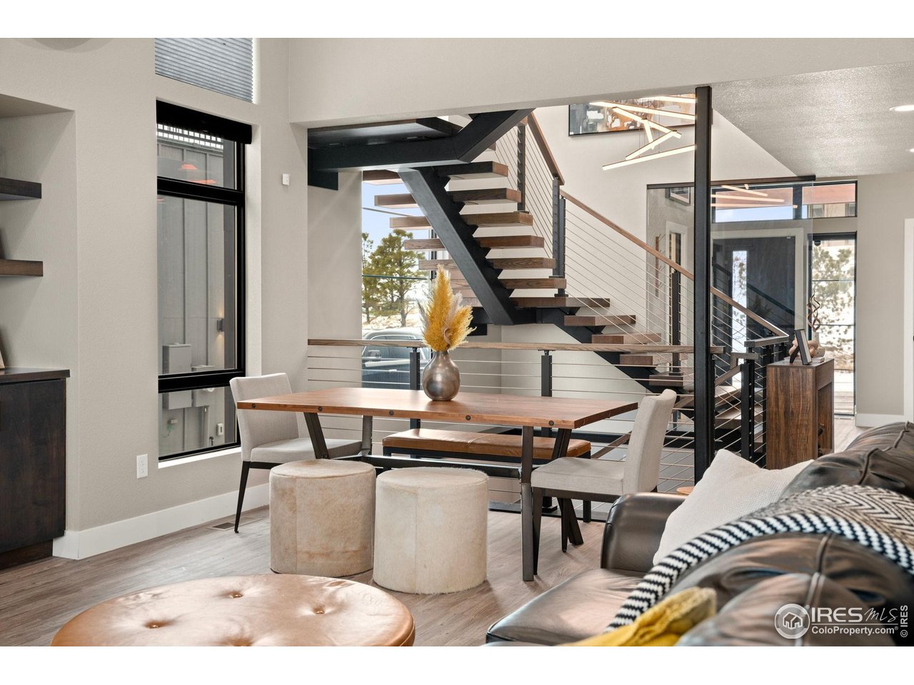 2089 Picture Point Drive Windsor, CO 80550 - Photo 35 of 45 a living room with chairs and a table