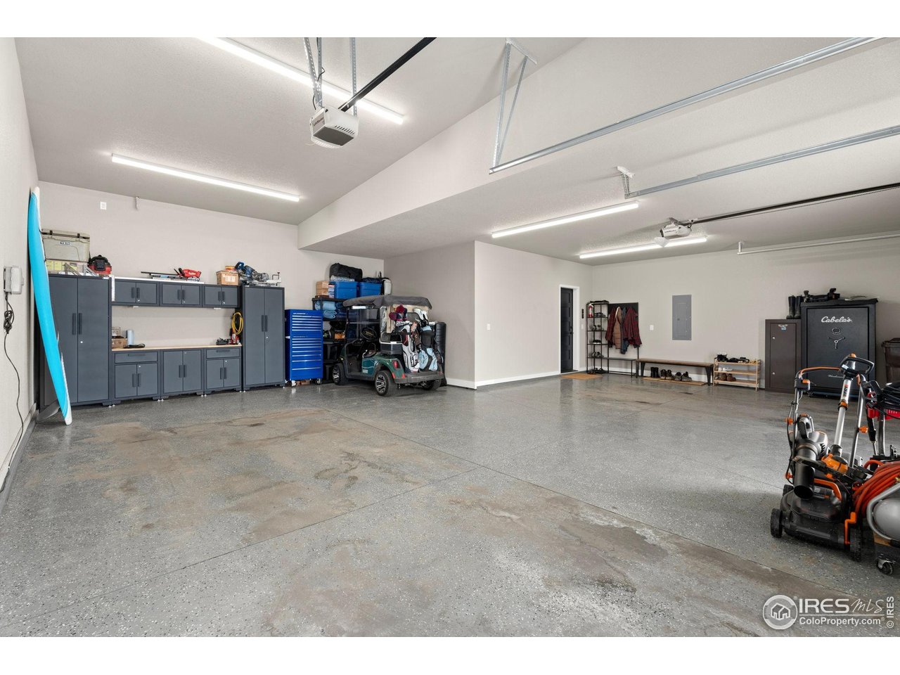 2089 Picture Point Drive Windsor, CO 80550 - Photo 37 of 45 a view of a livingroom with furniture and a garage