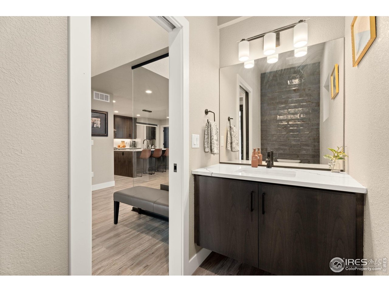 2089 Picture Point Drive Windsor, CO 80550 - Photo 4 of 45 a bathroom with a sink vanity and mirror