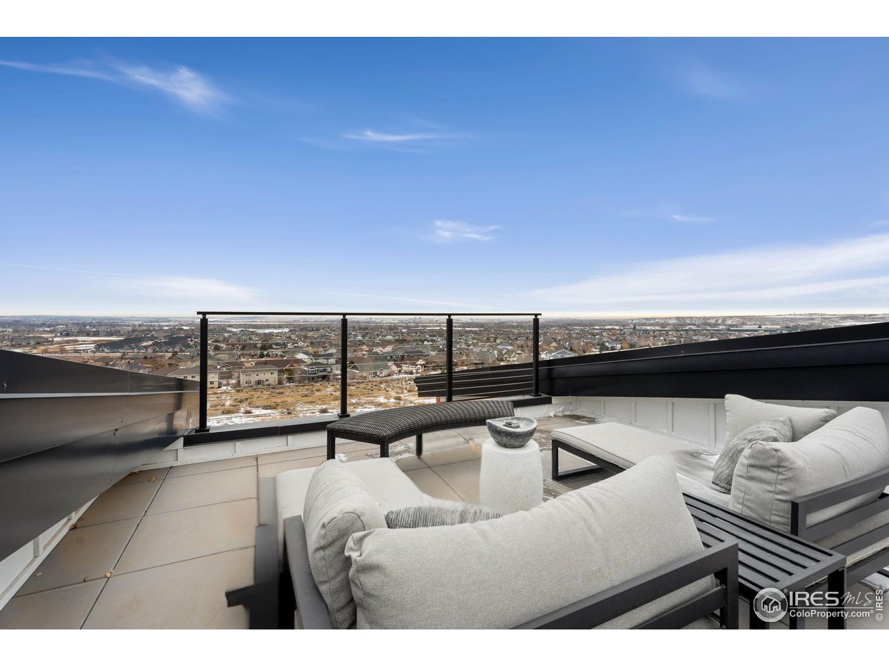 2089 Picture Point Drive Windsor, CO 80550 - Photo 41 of 45 a view of a terrace with couches and sky view