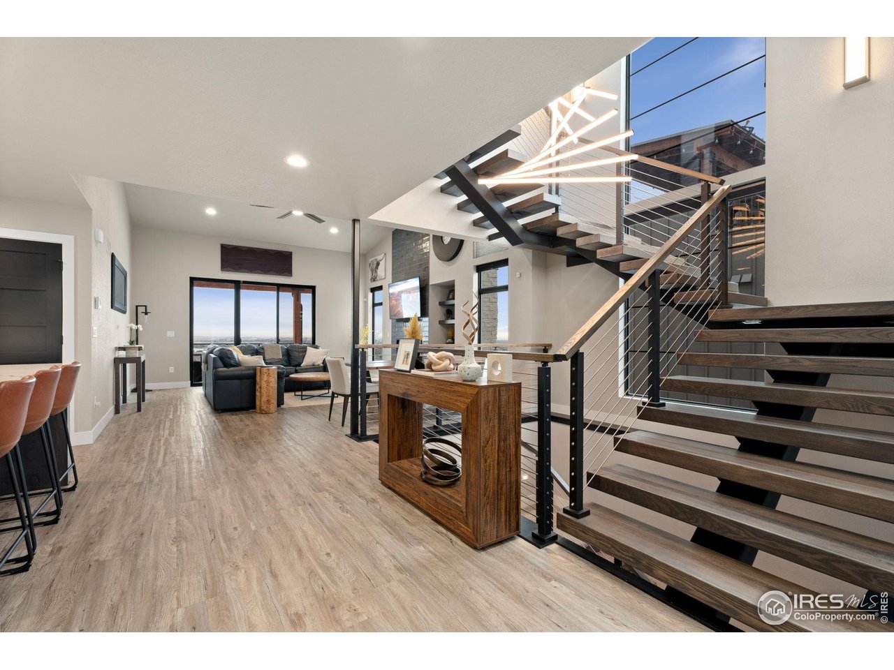 2089 Picture Point Drive Windsor, CO 80550 - Photo 5 of 45 a living room with lots of furniture and a wooden floor