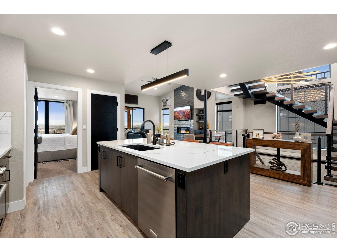 2089 Picture Point Drive Windsor, CO 80550 - Photo 10 of 45 a kitchen with a sink a counter top space and stainless steel appliances