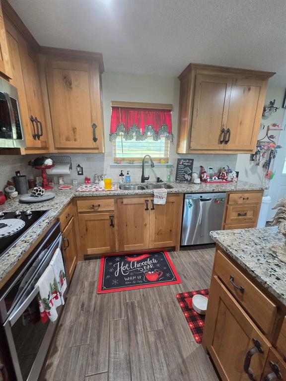 511 Erwin Road Poolville, TX 76487 - Photo 9 of 36 Granite Countertops and custom cabinetry