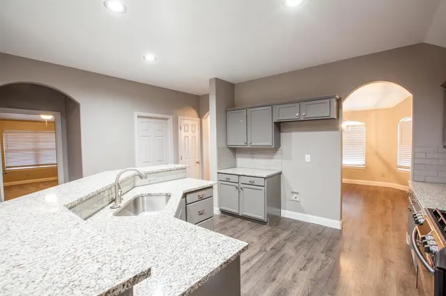 a view of gallery with wooden floor