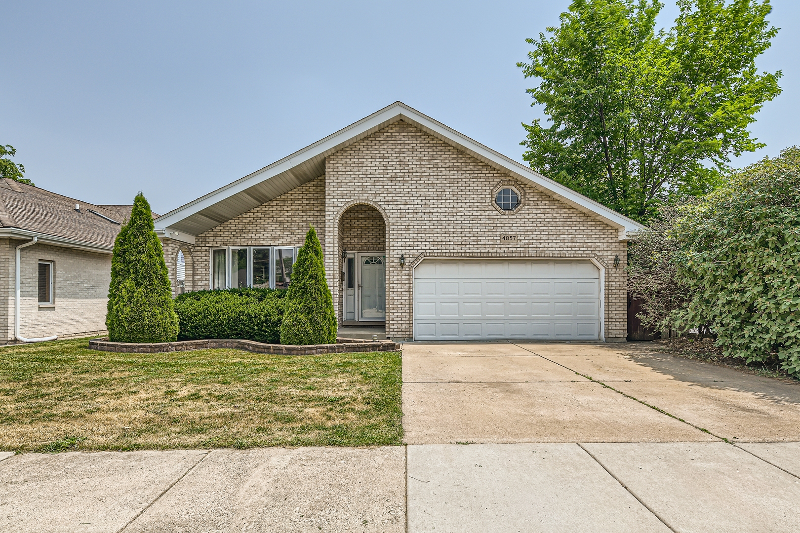 a front view of a house with yard