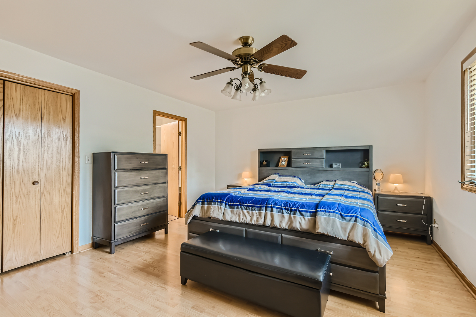 4057 Custer Avenue Lyons, IL 60534 - Photo 13 of 28 a bedroom with a bed and cabinets