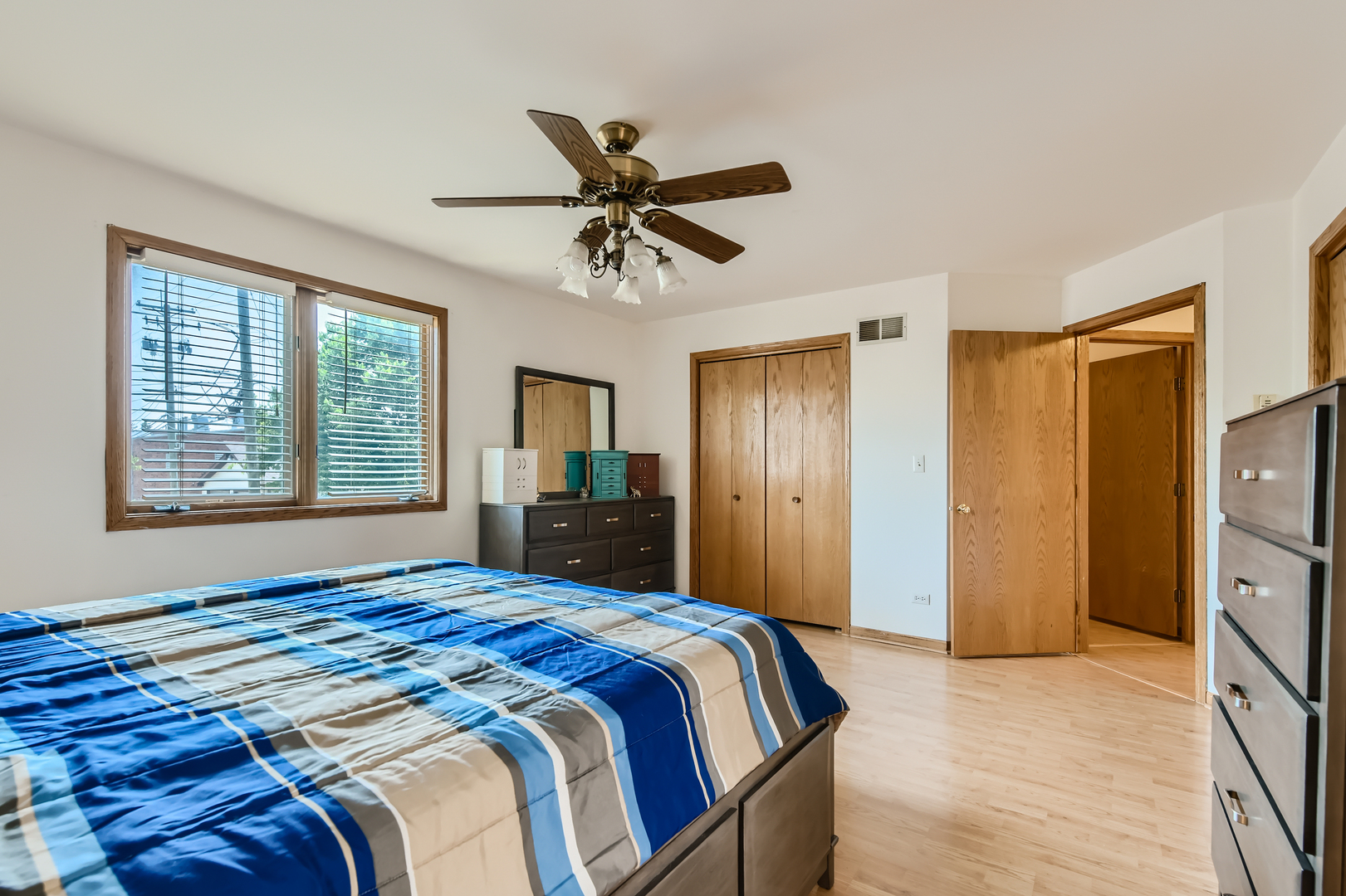 4057 Custer Avenue Lyons, IL 60534 - Photo 14 of 28 a bedroom with a bed dresser and a window