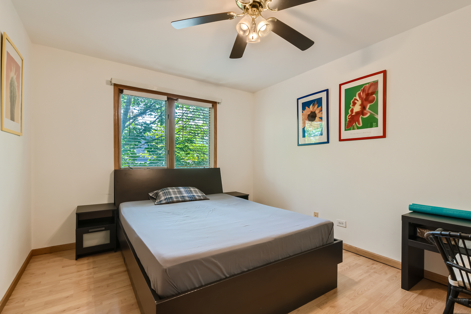 4057 Custer Avenue Lyons, IL 60534 - Photo 17 of 28 a bedroom with a bed and a chandelier