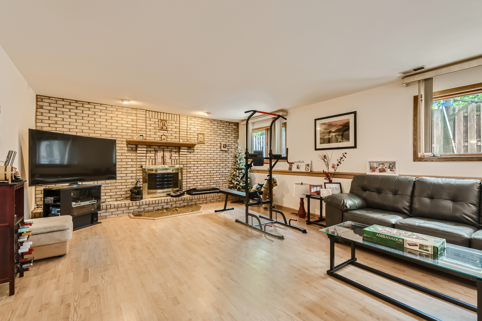 4057 Custer Avenue Lyons, IL 60534 - Photo 22 of 28 a living room with furniture and a flat screen tv