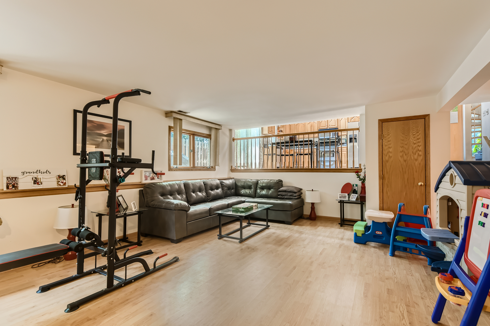 4057 Custer Avenue Lyons, IL 60534 - Photo 23 of 28 a living room with furniture gym equipment and a large window