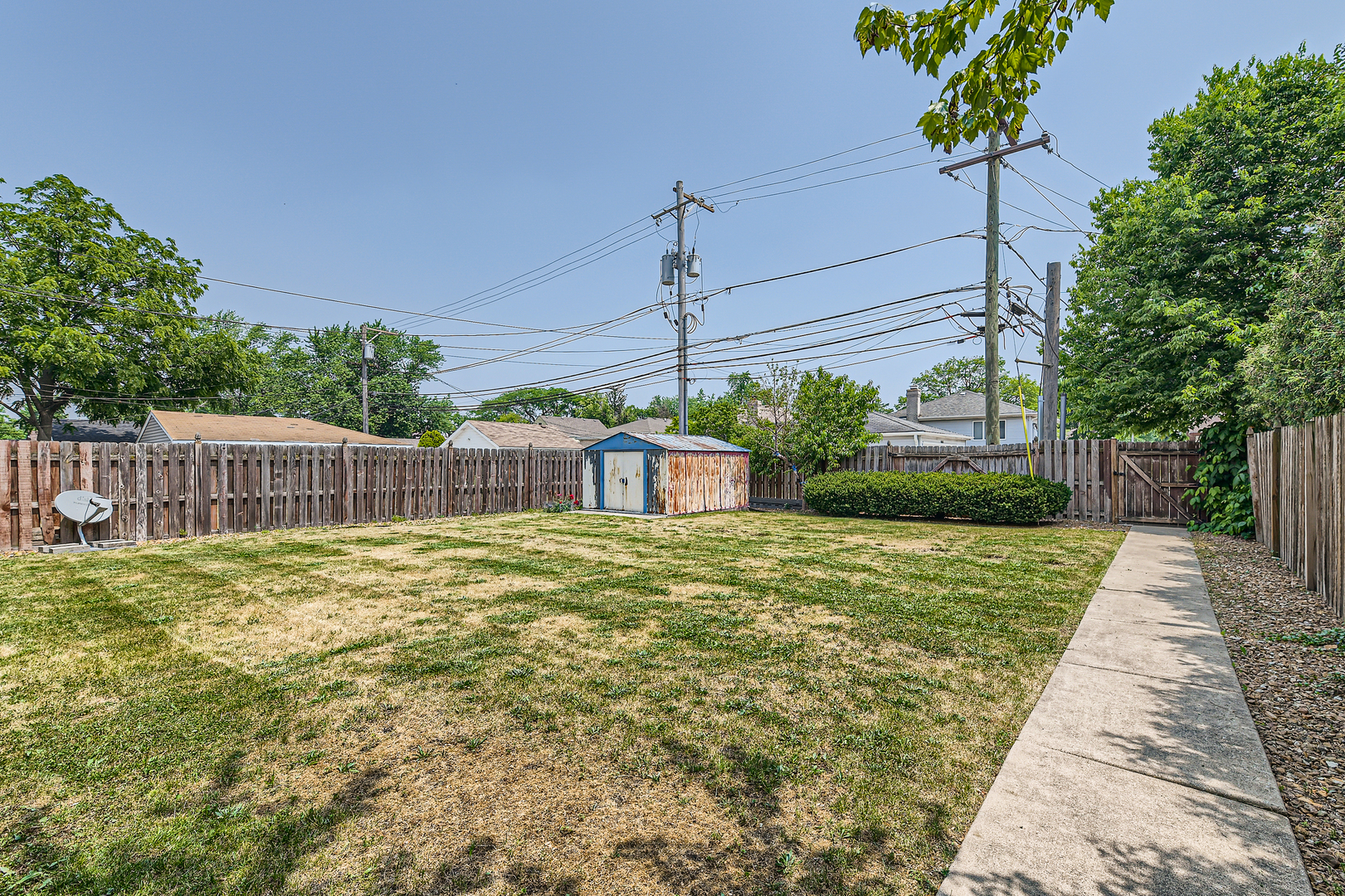 4057 Custer Avenue Lyons, IL 60534 - Photo 27 of 28 a white house that has a tree in it