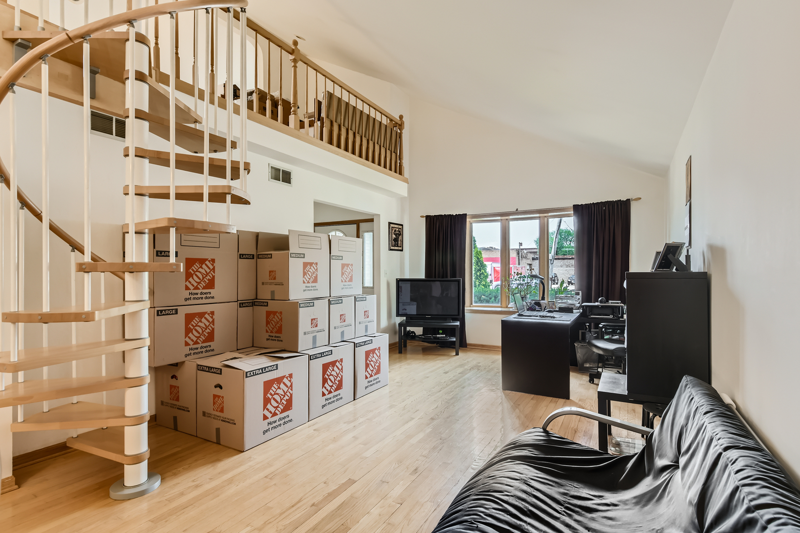 4057 Custer Avenue Lyons, IL 60534 - Photo 5 of 28 a living room with furniture a flat screen tv and a window
