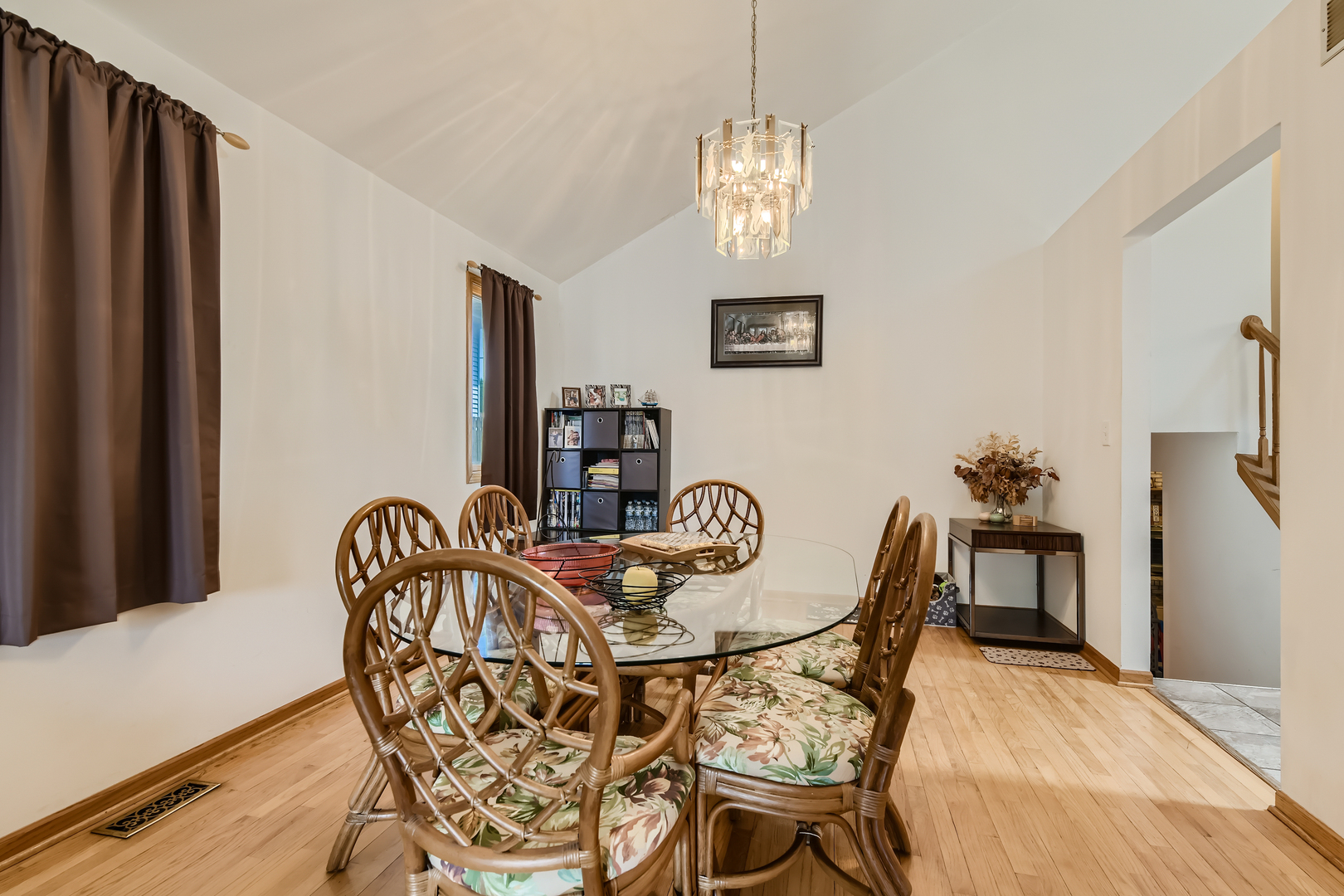 4057 Custer Avenue Lyons, IL 60534 - Photo 6 of 28 a dining room with furniture a chandelier and wooden floor