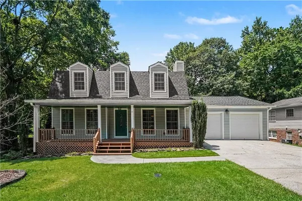 front view of a house with a yard