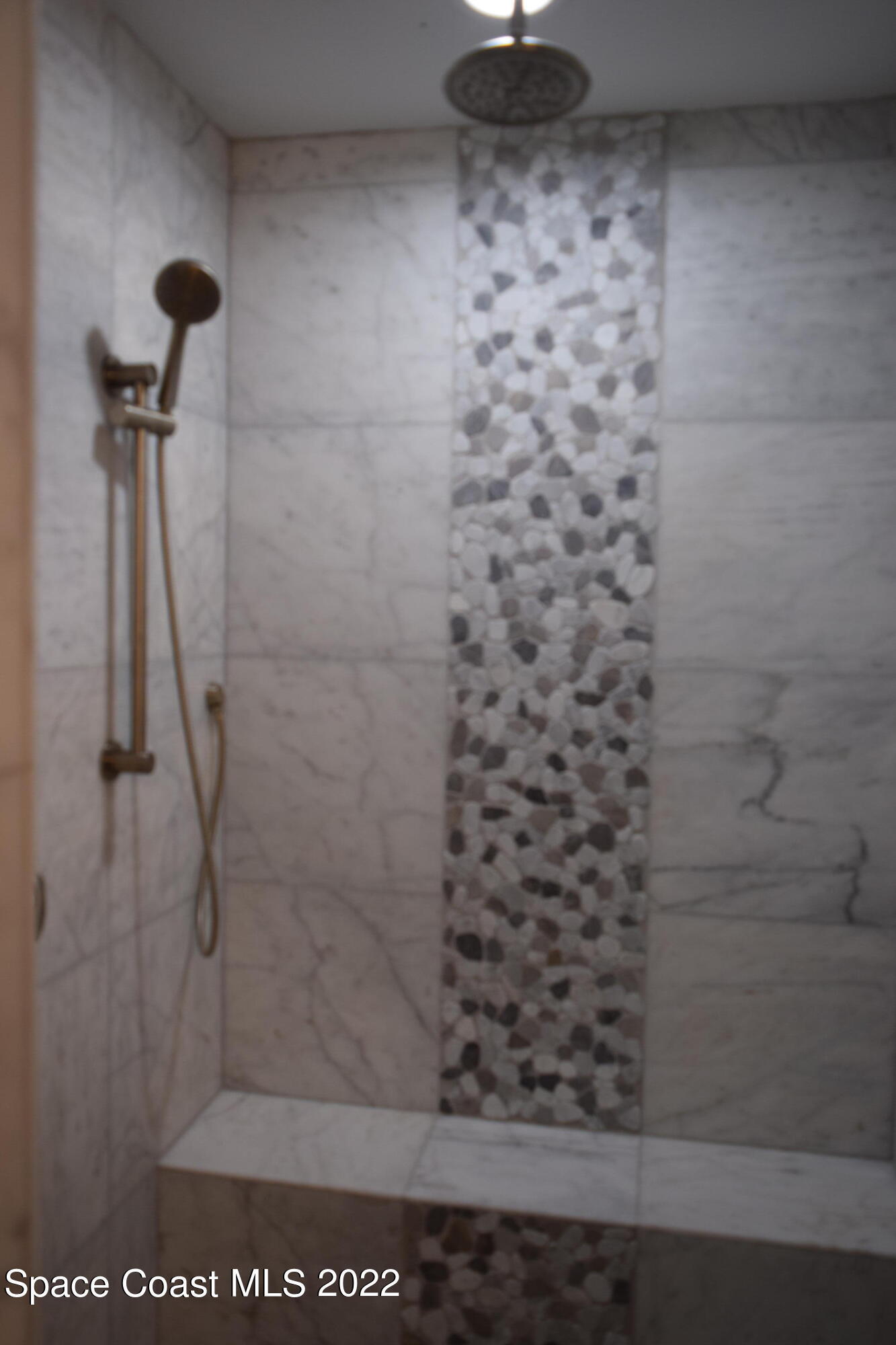 1328 Hazel Street Northwest Palm Bay, FL 32907 - Photo 12 of 28 a bathroom with a shower