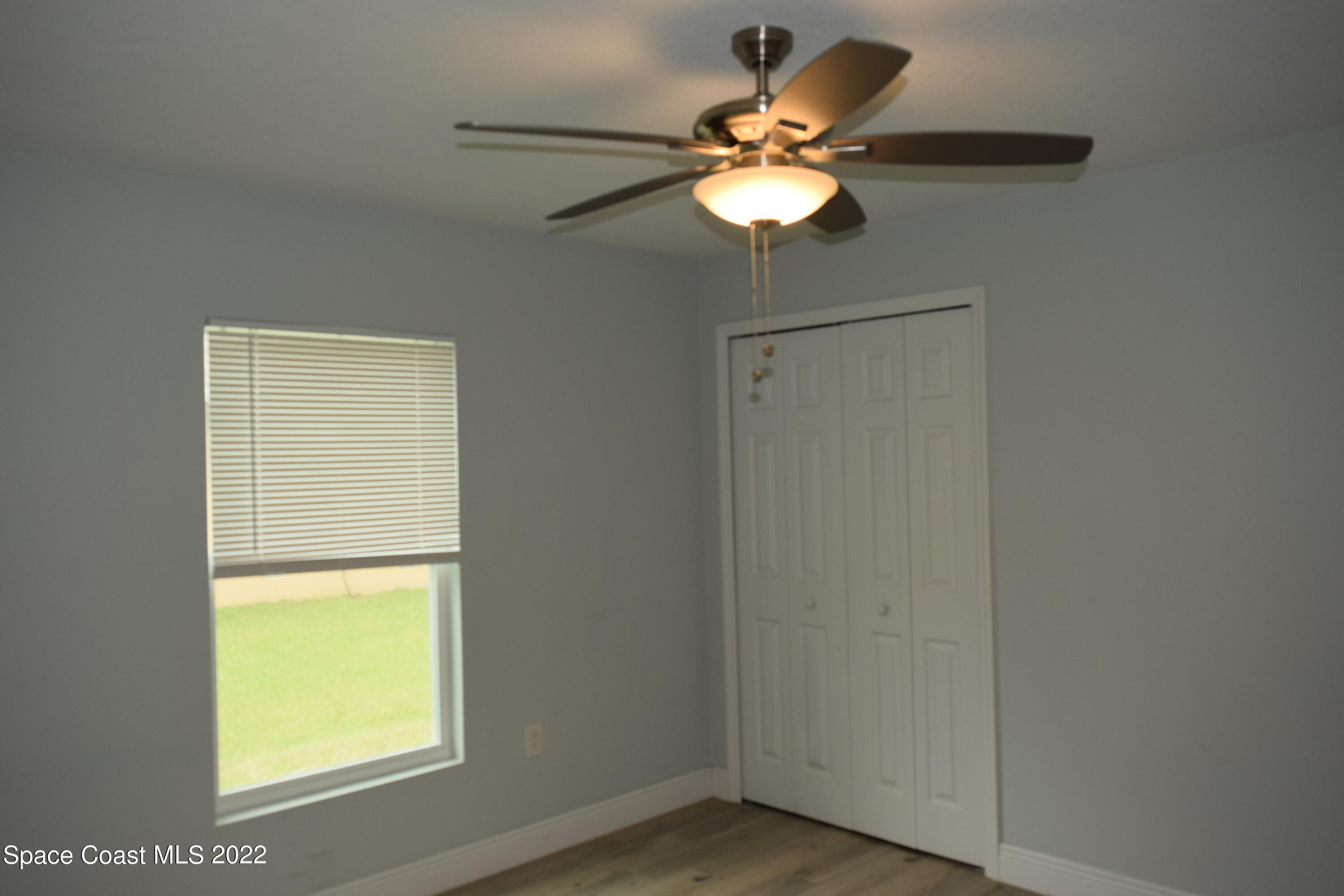 1328 Hazel Street Northwest Palm Bay, FL 32907 - Photo 14 of 28 an empty room with a window